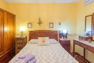 Cama o camas de una habitación en Casa Pilar con piscina