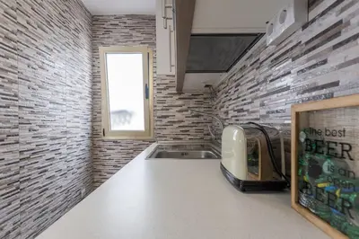Una cocina o zona de cocina en Cozy Apartment in Salinetas Beach.