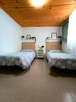 Cama o camas de una habitación en B&B and Apartments El Charco Azul