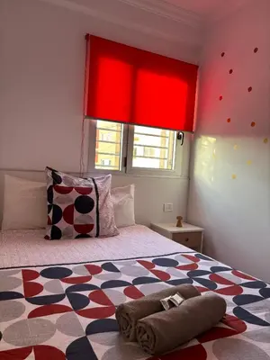 Cama o camas de una habitación en APARTAMENT SARDINA NEAR THE BEACH WITH POOL AND WIFI e