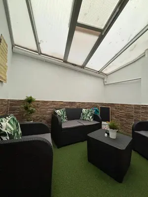 Zona de estar de APARTAMENT SARDINA NEAR THE BEACH WITH POOL AND WIFI e