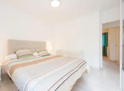 Cama o camas de una habitación en Bonito Bungalow a pocos metros de la playa