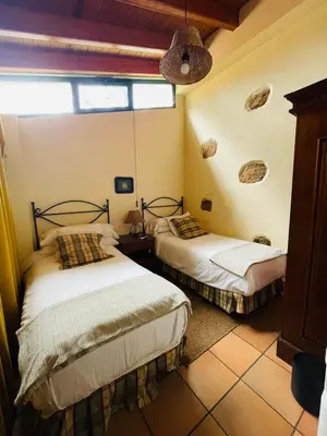 Cama o camas de una habitación en Casa Rural en medio del bosque, El Lance