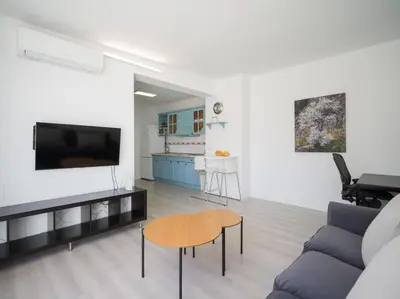 Una televisión o centro de entretenimiento en Penthouse Terrace city-sea view by CanariasGeytaway