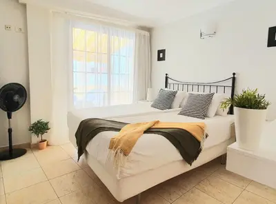 Cama o camas de una habitación en HD Mogan Beach Apartment
