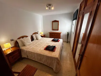 Cama o camas de una habitación en Espectacular en primera línea de la playa