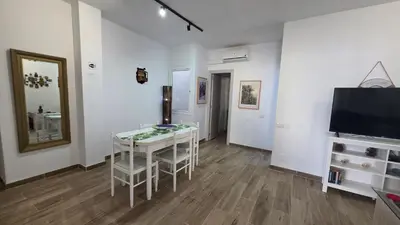 Una televisión o centro de entretenimiento en Apartment with terrace