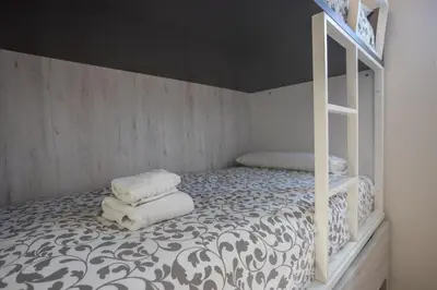 Cama o camas de una habitación en GuestReady - Los tunos 73