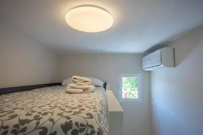 Cama o camas de una habitación en GuestReady - Los tunos 73