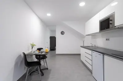 Una cocina o zona de cocina en APARTAMENTOS BLUE EYES