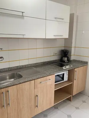 Una cocina o zona de cocina en Apartamentos Maspalomas Foresta