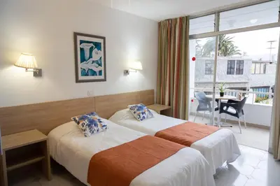 Cama o camas de una habitación en Apartamentos Maspalomas Foresta