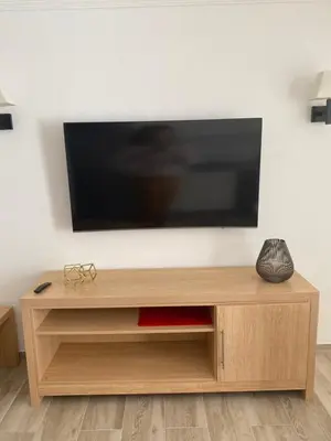 Una televisión o centro de entretenimiento en Apartamentos Maspalomas Foresta
