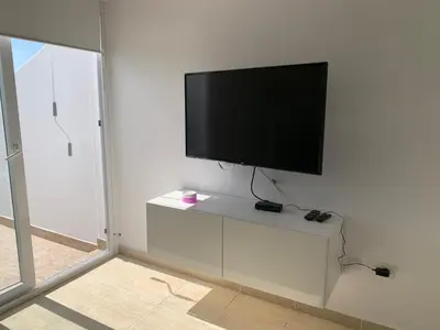 Una televisión o centro de entretenimiento en Bungalow en Vista Golf