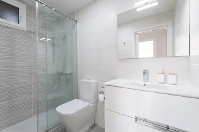 Un baño de Living Las Canteras Homes - BRIGHT BEACHFRONT