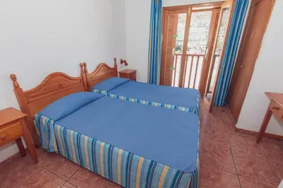 Cama o camas de una habitación en Montecarlo Apartamento8