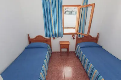 Cama o camas de una habitación en Montecarlo Apartamento8