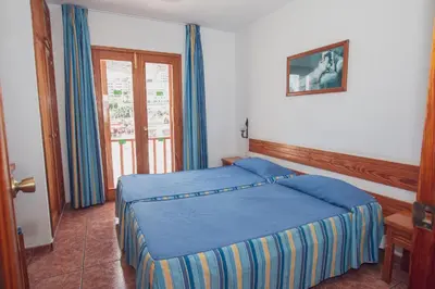 Cama o camas de una habitación en Montecarlo Apartamento30