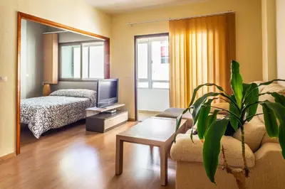 Cama o camas de una habitación en Central Las Canteras Beach