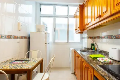 Una cocina o zona de cocina en Central Las Canteras Beach
