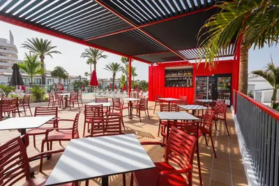 Un restaurante o sitio para comer en Sholeo Lodges Maspalomas