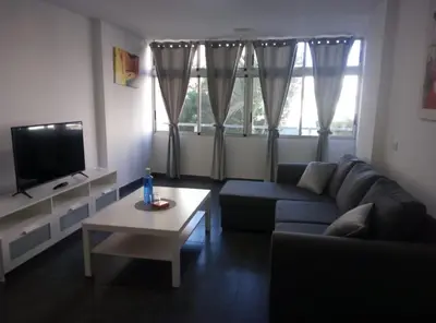 Una televisión o centro de entretenimiento en Apartament 5' CC Yumbo