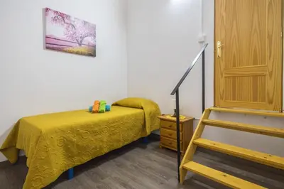 Cama o camas de una habitación en GuestReady - Gadi House Tasarte