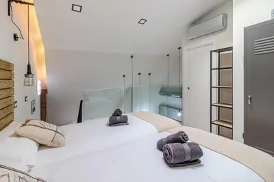 Cama o camas de una habitación en Apartamentos Marina Suites 6E