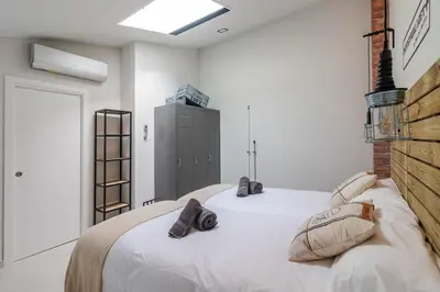 Cama o camas de una habitación en Apartamentos Marina Suites 6E