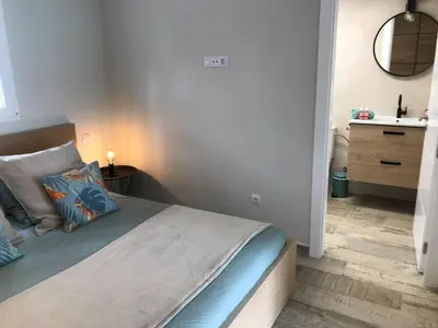 Cama o camas de una habitación en Harrys Palm Puerto de Mogán con jacuzzi