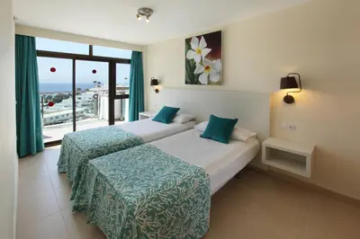 Cama o camas de una habitación en Grupotel Revoli