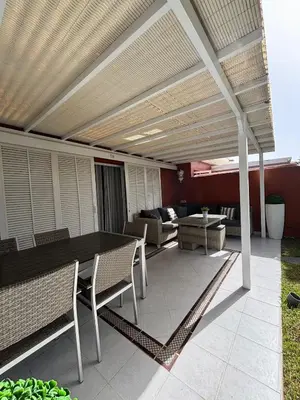 Zona de estar de Flamboyant Tree Garden Holiday Home