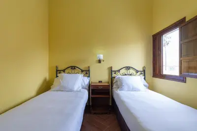 Cama o camas de una habitación en HomeForGuest NEW Duplex with Rooftop next to Arucas Cathedral