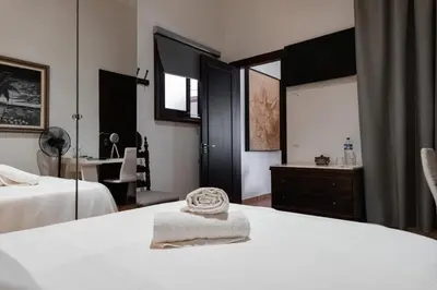 Cama o camas de una habitación en Santa Ana Suite & Rooms