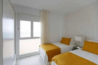 Cama o camas de una habitación en Apartamento frente a la playa de Las Canteras S3