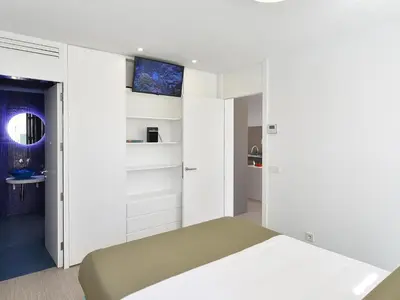 Cama o camas de una habitación en VelSuites Playa del Ingles by VillaGranCanaria