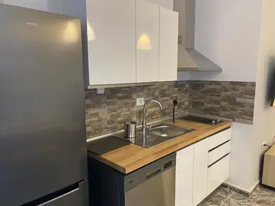 Una cocina o zona de cocina en Apartamentos La Aldea Suites