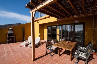 Un balcón o terraza de Atico en la Playa de La Aldea.
