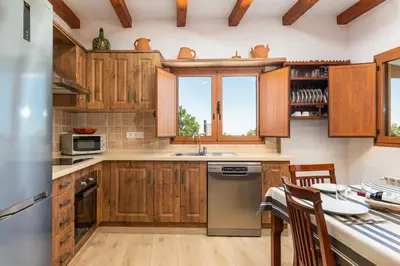 Una cocina o zona de cocina en HOLIDAYS HOME TINAMAR II