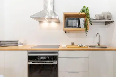Una cocina o zona de cocina en Paez Suites