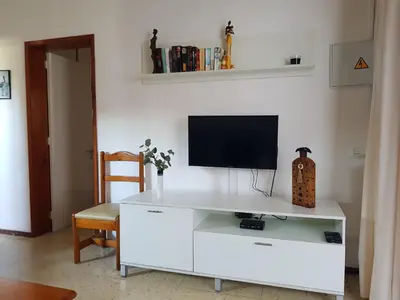 Una televisión o centro de entretenimiento en Apartamento en Playa del Inglés - Cerca del mar