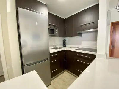 Una cocina o zona de cocina en Hermoso Edificio Frente al Mar, a pie de Playa y hermosas vistas