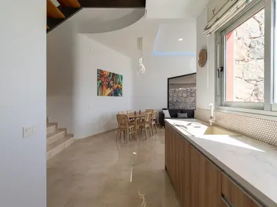 Una televisión o centro de entretenimiento en Salobre Villas Green