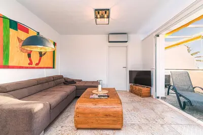 Zona de estar de Mogan luxury apartment, sea views, jacuzzi and sauna.