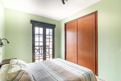 Cama o camas de una habitación en Adosado El Perenquen
