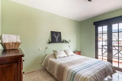 Cama o camas de una habitación en Adosado El Perenquen
