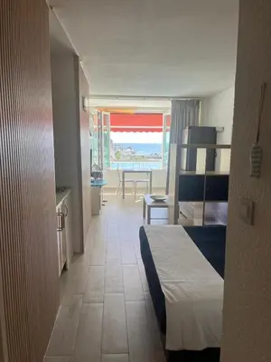 Cama o camas de una habitación en Tobago202