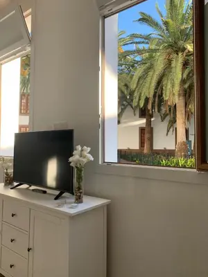 Una televisión o centro de entretenimiento en Alojamientos Agaete Pueblo N11