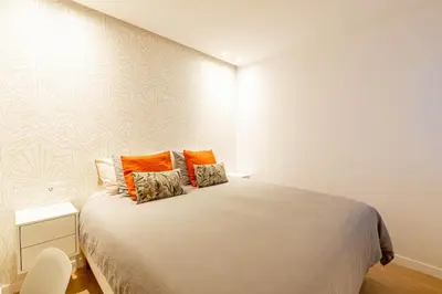 Cama o camas de una habitación en Apartamentos Deluxe Strada