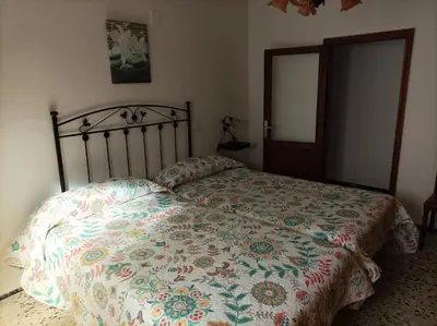 Cama o camas de una habitación en Vivienda Vacacional Casa Uca